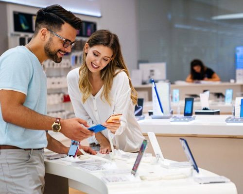 shopping-a-new-digital-device-happy-couple-buying-a-smartphone-in-store.jpg